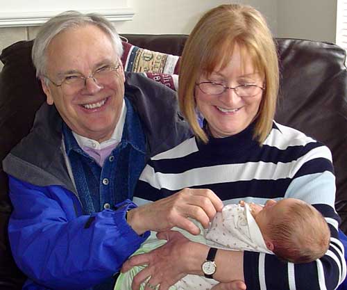 Photo of John and Dianne Hartley Guineven, with grandchild, Henry